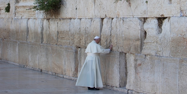 Pope Francis prays in front of the Western Wall in Jerusalem's Old City yesterday as part of his Middle East pilgrimage. Photo / AP