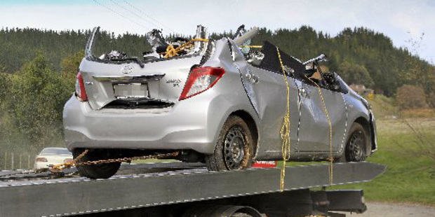 The Napier Fire Service had to remove the roof of the Toyota Yaris to free an 89-year-old woman who had been trapped in the vehicle with her husband's body 15hours overnight. Photo/Warren Buckland