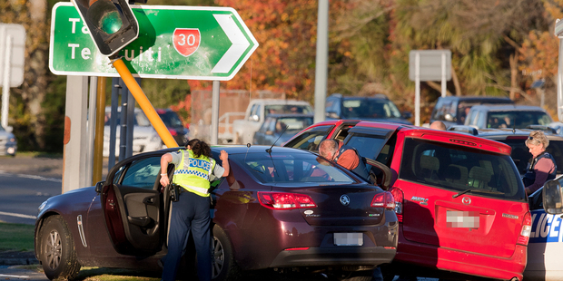 A police chase across the city ended in a crash by Puarenga Park. Photo / Ben Fraser