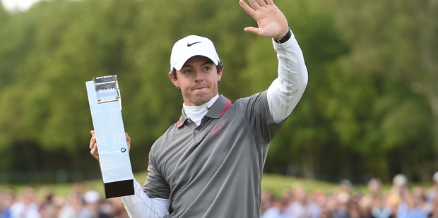 Rory McIlroy celebrates with the BMW PGA Championship trophy after a torrid week off the course. Photo/ AP