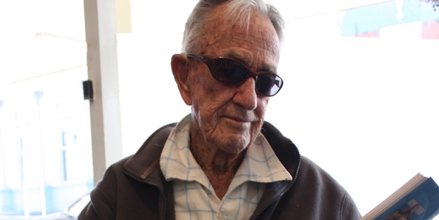 Howard Tod of Norsewood with his limited edition of Near the end of Te Whiti Road. Photo/Christine McKay