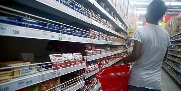 An Indonesian woman shops for chocolate bars. Photo / AFP
