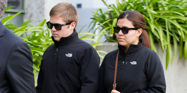 Cody Dickey leaves Hamilton District Court with his wife after admitting two charges of careless driving causing death and injury. Photo / Mike Walen