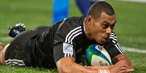 New Zealand winger Tevita Li scores one of his three tries against South Africa in Albany last night. Photo / Greg Bowker