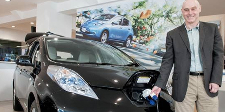 Electric car advocate Doug Clover with Nissan's Leaf.