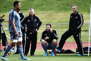 Injured players, Kieran Read and Sam Cane of the All Blacks look on from the sidelines as Jerome Kaino runs through drills during a New Zealand All Blacks training. Photo / Getty.