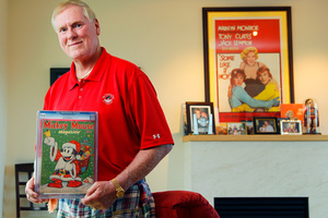 John C. Wise, poses in his San Diego home with a 1937 Mickey Mouse Magazine. Photo / AP
