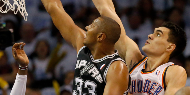 San Antonio Spurs forward Boris Diaw (33) and Oklahoma City Thunder center Steven Adams (12) go after a rebound in the first half of Game 6. Photo / AP