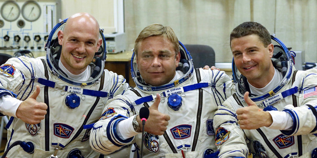 European Space Agency's astronaut Alexander Gerst, left, Russian cosmonaut Maxim Suraev, center, and NASA astronaut Reid Wiseman, crew members currently at the International Space Station. Photo / AP