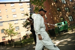 A New York Police Department investigator leaves the entrance to the building where two children were attacked with a knife in a Brooklyn apartment lift. Photo / AP