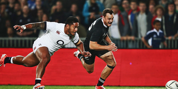 Manu Tuilagi competes with Israel Dagg for the ball. Photo / Getty Images