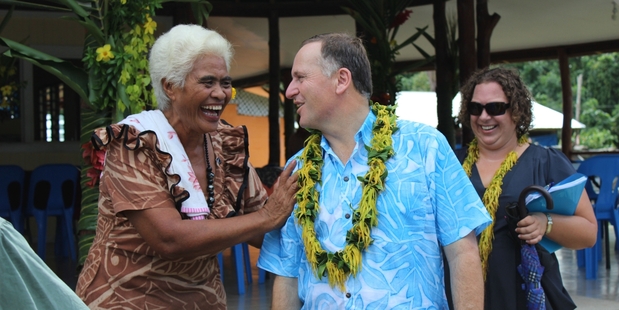 John Key receives a warm welcome from former Aucklander "Aunty" Mago Masoe.