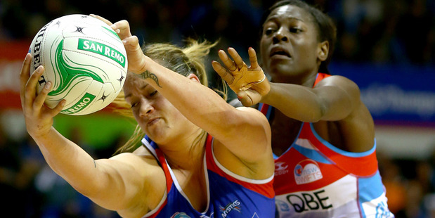 Catherine Latu of the Mystics gets posession ahead of Sonia Mkoloma of the Swifts. Photo / Getty Images