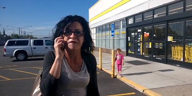 A woman has been filmed launching into a racist tirade outside a supermarket. Photo / YouTube