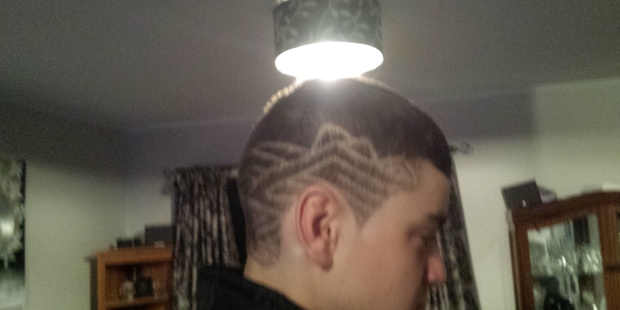 A young man has been indefinitely stood down at Tararua College for shaving a tribal pattern on one side of his head. It's considered offensive.
