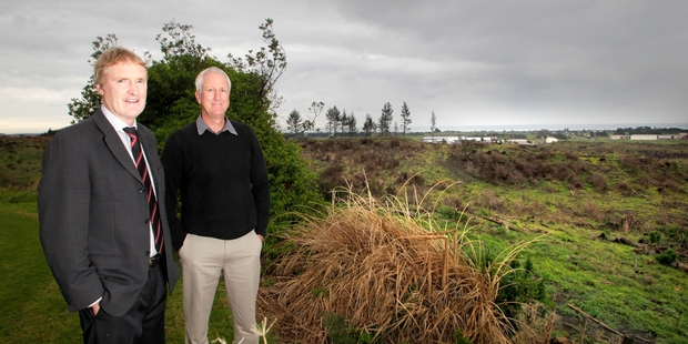 Gregor Vallely (left) and Neil Hooker on the second tee at Belmont with the cleared forestry block land behind that has proved a real earner for the club. Photo/Bevan Conley