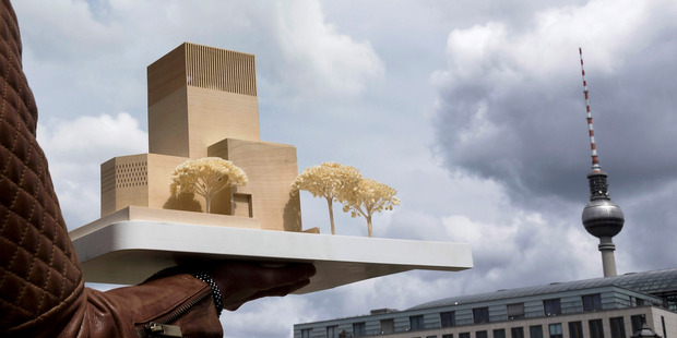 A woman holds the model of the "House of One" at Petriplatz in Berlin, Germany. Photo / Getty Images