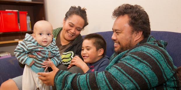 Te Atakura Mokotupu with Hawea, 9 months, Nga toi o rangi Mokotupu, 5, and Temu Mokotupu at home in Napier. Photo / Glenn Taylor