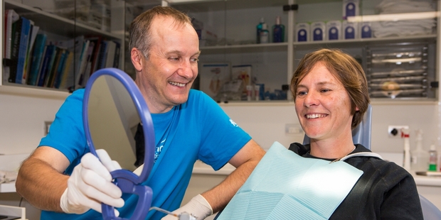 Tauranga mother-of-five Catherine Irvine has had two fillings done for free by the Tauranga branch of Lumino Dentists ahead of a free day for parents of children supported by KidsCan.