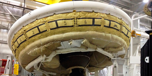 A saucer-shaped test vehicle known as a Low Density Supersonic Decelerator holding equipment for landing large payloads on Mars. Photo / AP