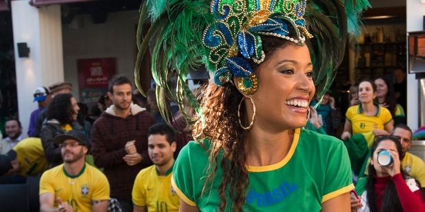 Brazilian dancer Aline Silva entertains the large crowd that gathered at Santos Cafe in Ponsonby for the opening of the Football Worldcup on Friday morning. Photo / Greg Bowker