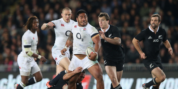 Manu Tuilagi of England is tackled by Aaron Cruden during the International Test Match between the New Zealand All Blacks and England. Photo / Getty Images.