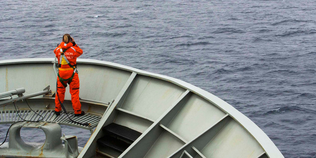 A lookout is stationed on bow of HMAS Success during the search of the missing MH370. Photo / AP