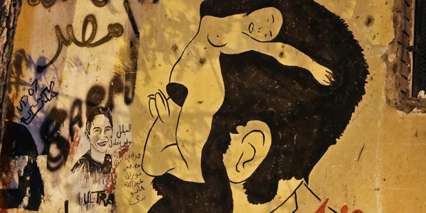 Anti-sexual harassment graffiti has been painted on a wall near Tahrir Square, Cairo, Egypt. Photo / AP
