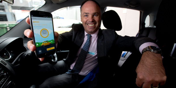 David Hancock, chief executive for Tower Insurance, showing off the company's 'SmartDriver' app earlier this year. This kind of 'telematics' is revolutionising car insurance. Photo / Dean Purcell.