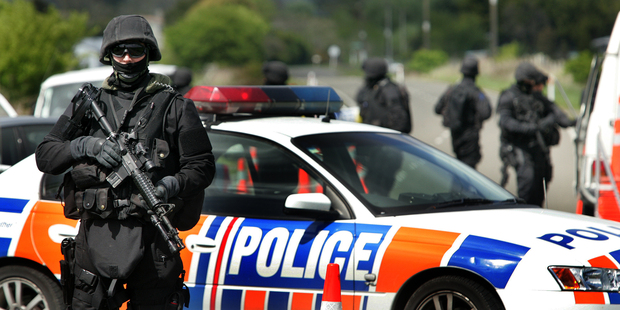 Armed police at a roadblock in the Ruatoki Valley during 2007's raids. Photo / Alan Gibson