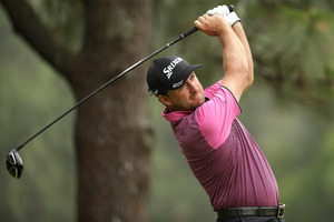 Graeme McDowell, of Northern Ireland, watches his tee shot on the second hole during the first round of the U.S. Open. Photo / AP