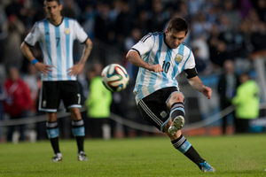 Lionel Messi kicks a soccer ball during a football match for Argentina. Photo / AP