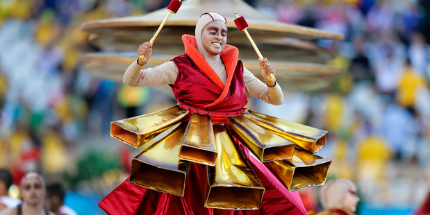 An actor performs during the opening ceremony of the 2014 World Cup at Itaquerao Stadium before the group A match between Brazil and Croatia. Photo / AP