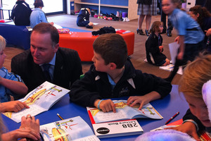 John Key chats with kids at Pegasus Bay School. Photo / APNZ