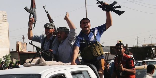 Iraq Shia fighters answer a call to arms in Basra, 550km southeast of the capital, Baghdad. Photo / AP