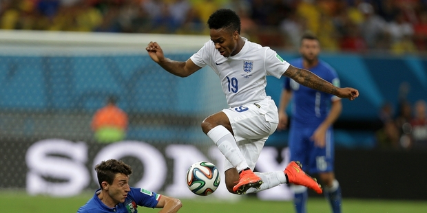 Raheem Sterling, 19, is challenged by Italy's Matteo Darmian at the World Cup. Picture / AP