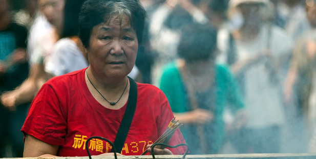 One of the relatives of Chinese passengers onboard the missing Malaysia Airlines Flight MH370. Photo / AP