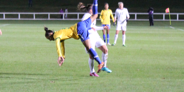 A Brazil player goes flying. PHOTO: Rory Scott.