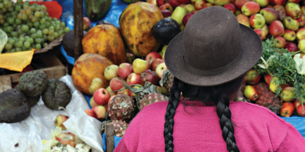 A Peruvian woman sells fresh exotic produce.