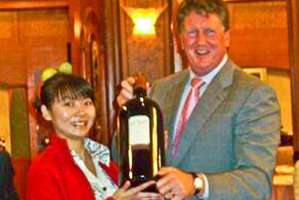 Liu's partner and the bottle of wine.