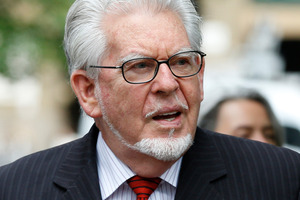 Harris is charged with 12 counts of indecent assault against four girls in the UK between 1968 and 1986. Photo / AP
