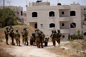 Israeli soldiers conduct a military operation to search for three missing teenagers outside the West Bank city of Hebron. Photo / AP