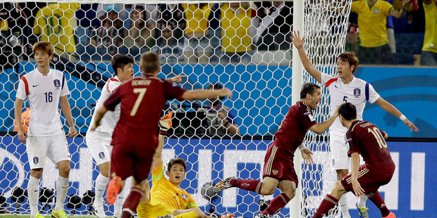 Russia's Alexander Kerzhakov, third right, celebrates after scoring his side's first goal during the group H World Cup soccer match between Russia and South Korea. Photo / AP