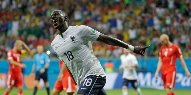 France's Moussa Sissoko celebrates after scoring his side's fifth goal during the group E World Cup soccer match between Switzerland and France. Photo / AP