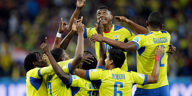 Ecuador's Enner Valencia, center, celebrates with teammates after scoring his team's second goal during the group E World Cup soccer match between Honduras and Ecuador. Photo / AP
