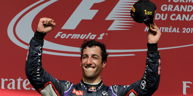 Red Bull driver Daniel Ricciardo, from Australia, celebrates after winning the 2014 Canadian Grand Prix. Photo / AP