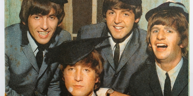 The Beatles with the borrowed school caps during their visit to Auckland in 1964. Photo / John Baker collection