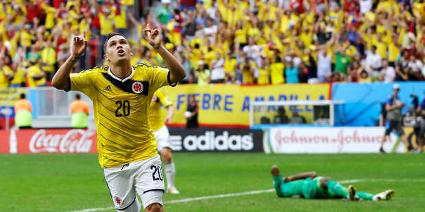 Colombia's Juan Quintero, left, celebrates after scoring his side's second goal against Ivory Coast. Photo / AP