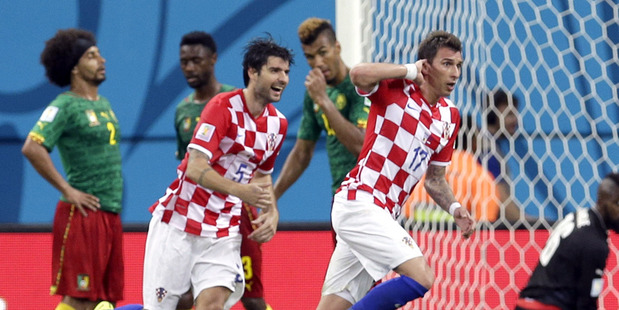 Croatia's Mario Mandzukic, second right, celebrates after scoring his side's third goal. Photo / AP