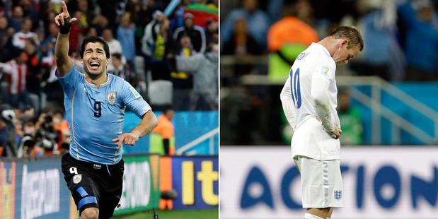 Uruguay's Luis Suarez celebrates the matchwinner while Wayne Rooney reacts to the 2-1 defeat. Photo / AP